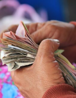 A person holding cash