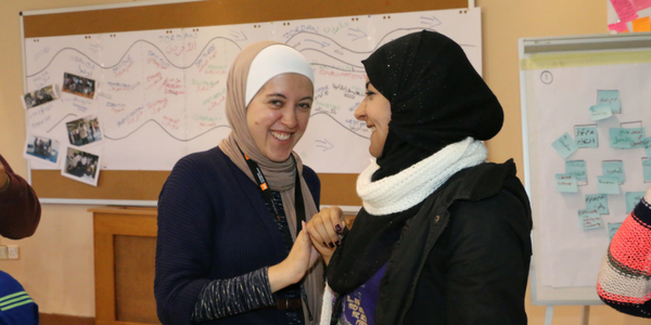 Two adolescent Syrian refugees at a Youth Consultation in Jordan.