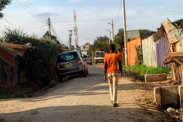 A young man walks in Kenya