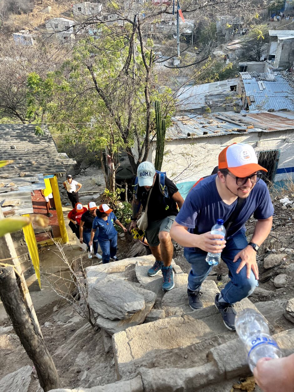 A group of people climbing up steep steps.
