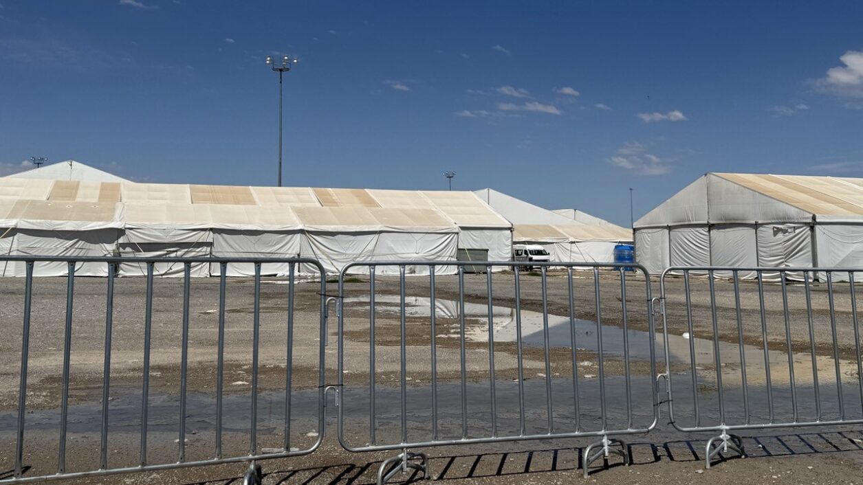 tents behind security fencing