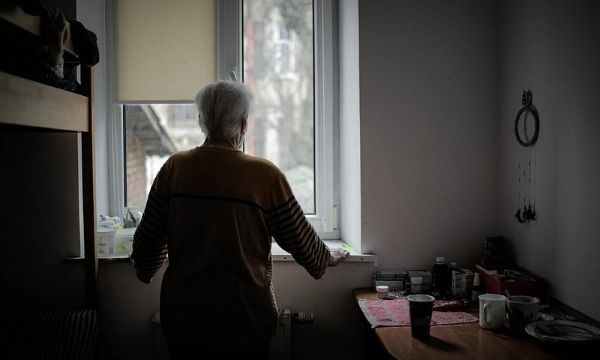 woman looking out window